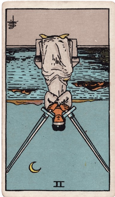 Two of Swords Reversed Meaning